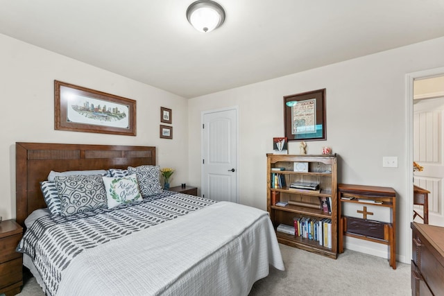 bedroom with light colored carpet