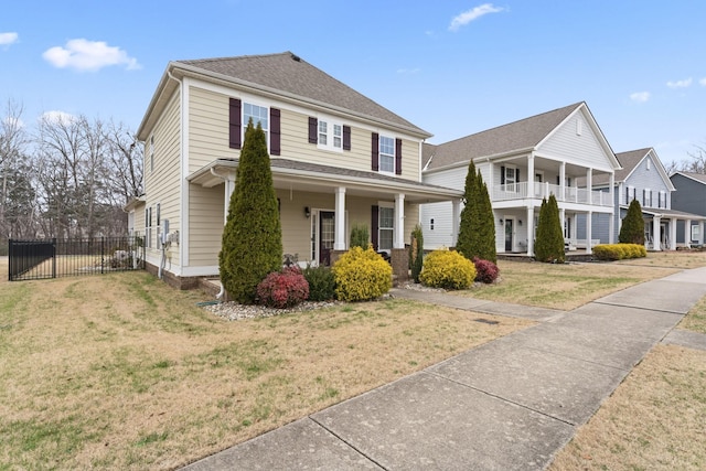 view of front of home featuring a porch and a front lawn