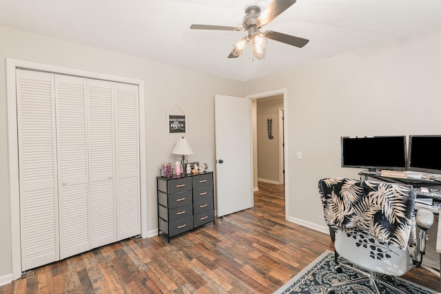 office space featuring ceiling fan and dark hardwood / wood-style flooring