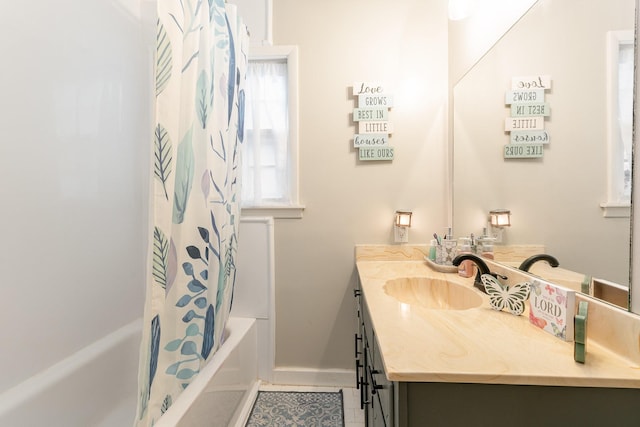 bathroom with vanity and shower / tub combo