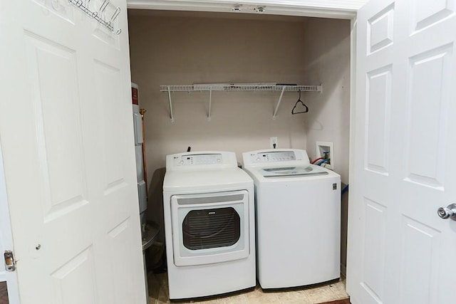 laundry room with washing machine and clothes dryer