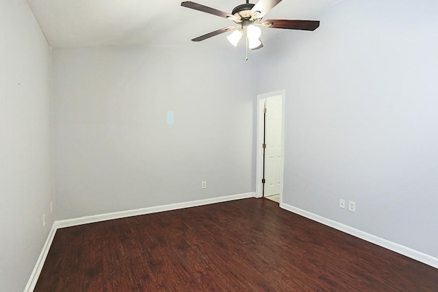 unfurnished room with a towering ceiling, ceiling fan, and hardwood / wood-style floors