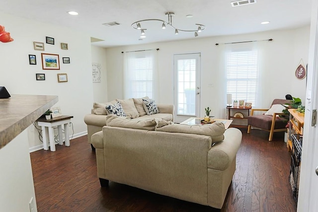 living room with dark hardwood / wood-style flooring