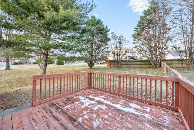 wooden terrace featuring a yard