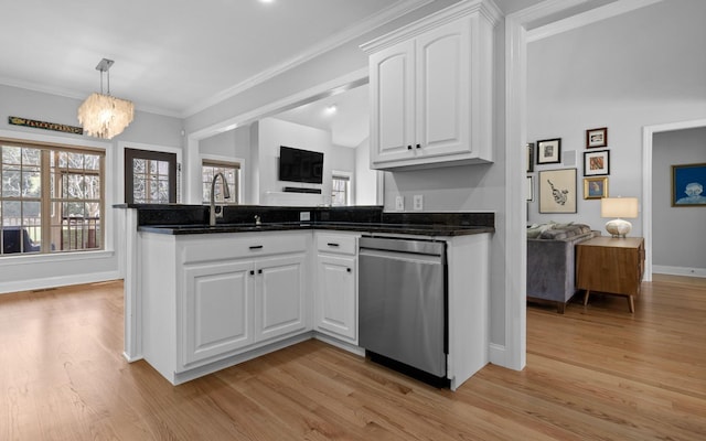 kitchen featuring stainless steel dishwasher, white cabinetry, light hardwood / wood-style floors, and a notable chandelier