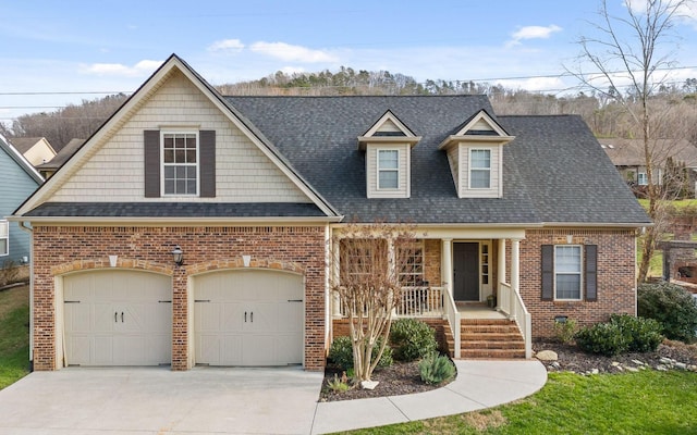 view of front of property with a porch and a garage