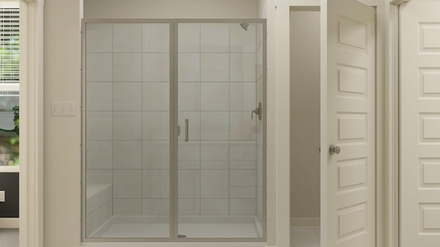 bathroom featuring a shower with shower door