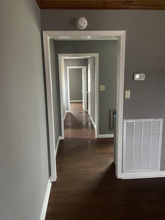 corridor featuring dark hardwood / wood-style flooring