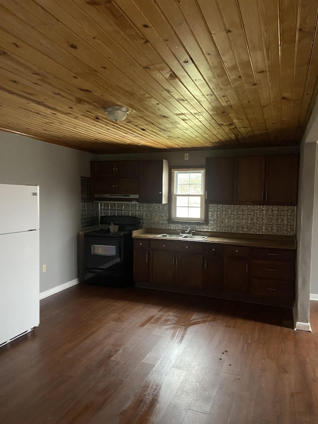 kitchen featuring black electric range oven, sink, white refrigerator, dark hardwood / wood-style flooring, and decorative backsplash