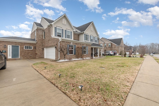 view of front of house featuring a front lawn and a garage