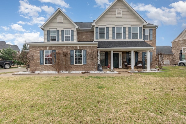 view of front of house with a front lawn and a porch