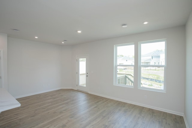 spare room with light wood-type flooring