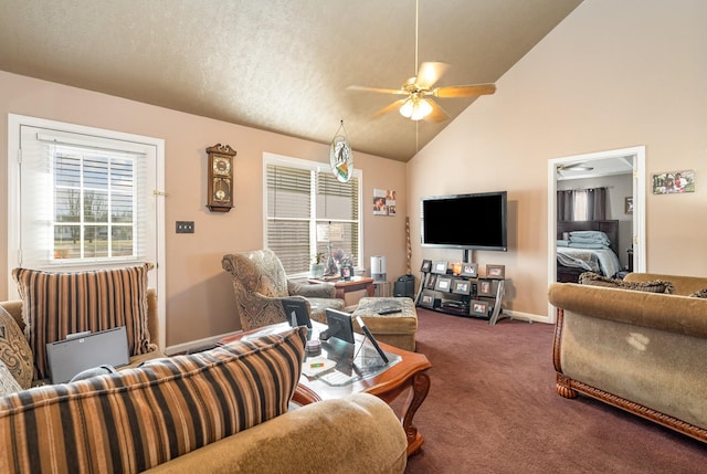 living room with ceiling fan, high vaulted ceiling, and dark colored carpet