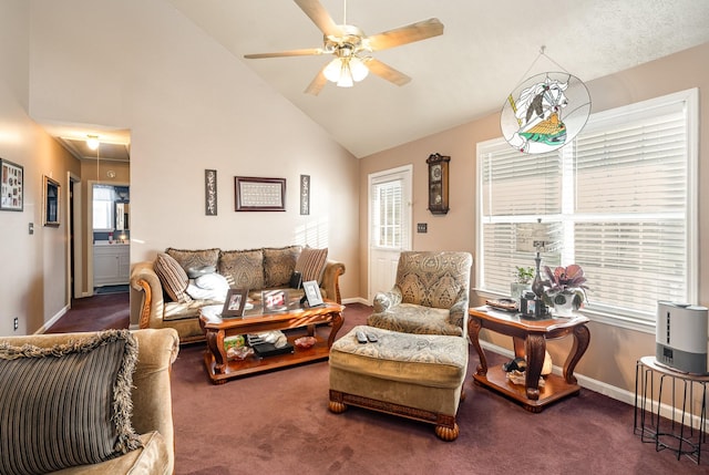 living room with ceiling fan, high vaulted ceiling, and dark colored carpet