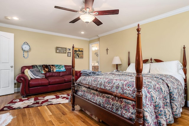 bedroom with hardwood / wood-style floors, ceiling fan, and crown molding