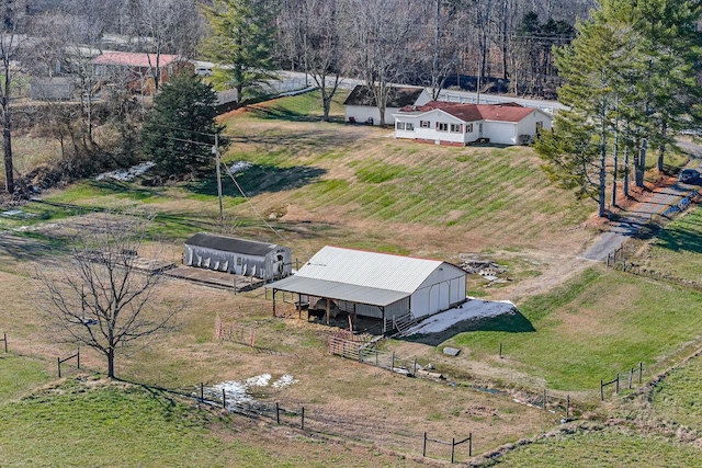 birds eye view of property featuring a rural view