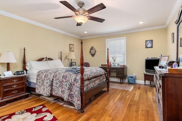 bedroom with ceiling fan, crown molding, and light hardwood / wood-style flooring