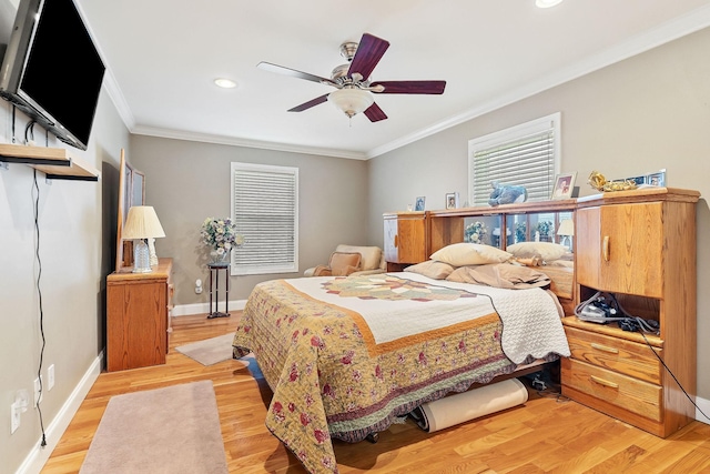 bedroom with ceiling fan, light wood-type flooring, and ornamental molding