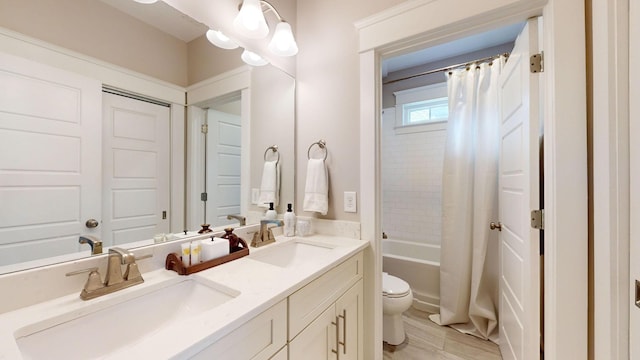 full bathroom with toilet, vanity, and shower / bath combination with curtain