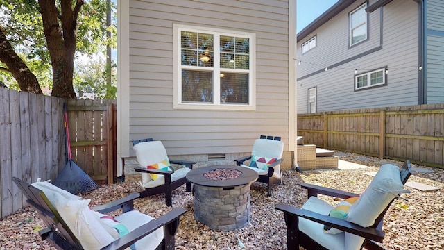 view of patio / terrace with an outdoor fire pit