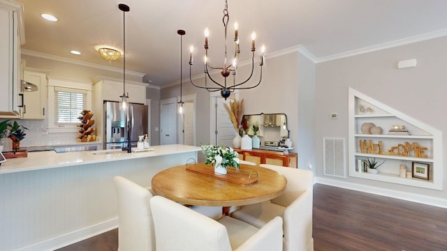 dining space featuring ornamental molding, dark hardwood / wood-style flooring, and built in shelves