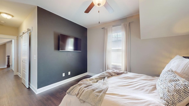 bedroom featuring ceiling fan and dark hardwood / wood-style flooring