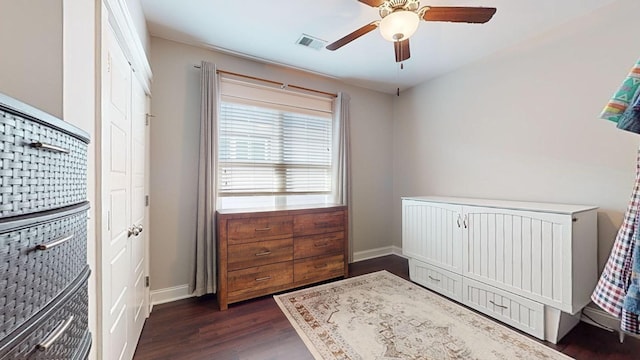 bedroom featuring ceiling fan and dark hardwood / wood-style floors