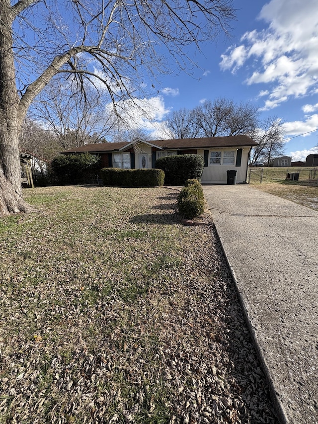 single story home with a carport