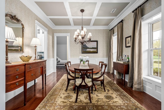 dining space featuring a chandelier, beam ceiling, crown molding, dark hardwood / wood-style flooring, and coffered ceiling