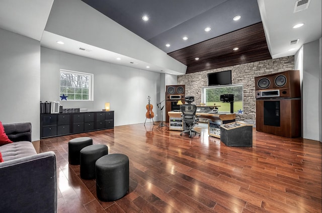 living room with high vaulted ceiling and dark hardwood / wood-style floors