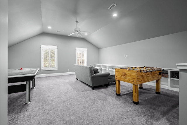 rec room with carpet floors, ceiling fan, and vaulted ceiling