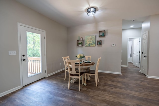 dining room with dark wood-type flooring