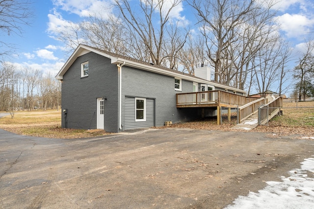 view of side of home featuring a deck