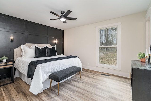 bedroom featuring ceiling fan and light hardwood / wood-style floors