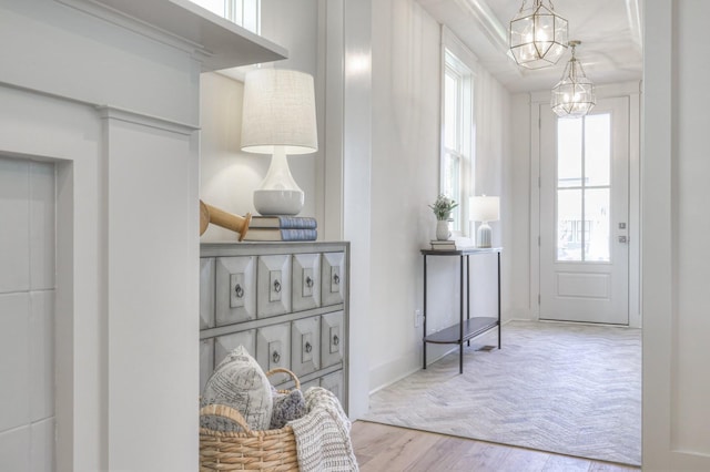 interior space with hardwood / wood-style floors and a notable chandelier