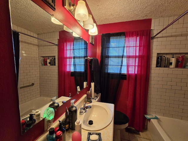 full bathroom with sink, tile patterned flooring, toilet, and shower / tub combo with curtain