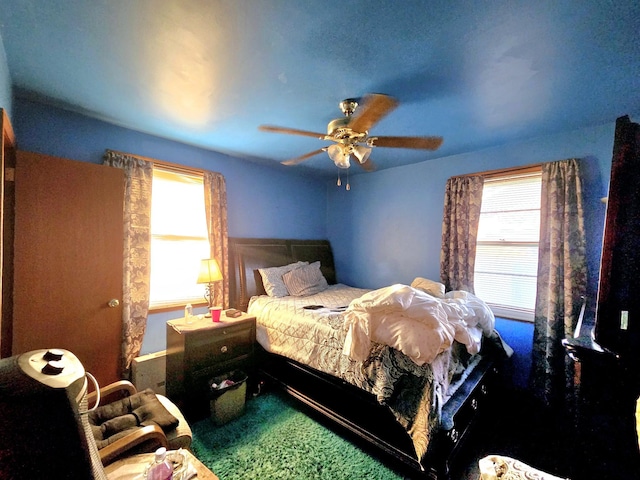 bedroom featuring ceiling fan and carpet flooring