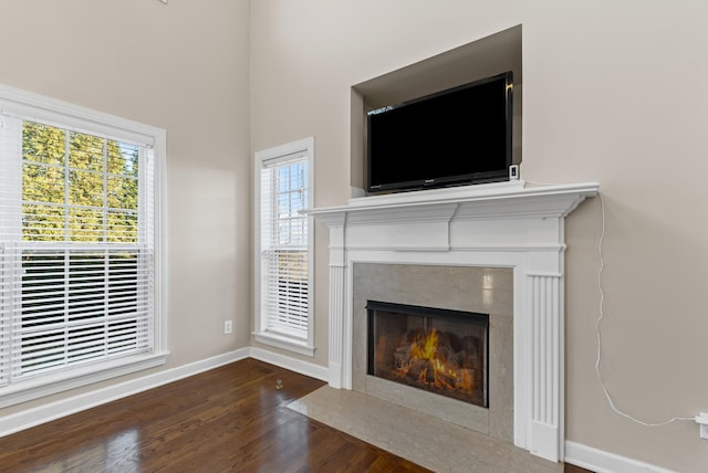 interior details with a fireplace and hardwood / wood-style flooring