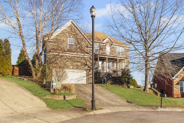 front of property with a front lawn and a garage