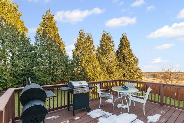 wooden deck featuring area for grilling