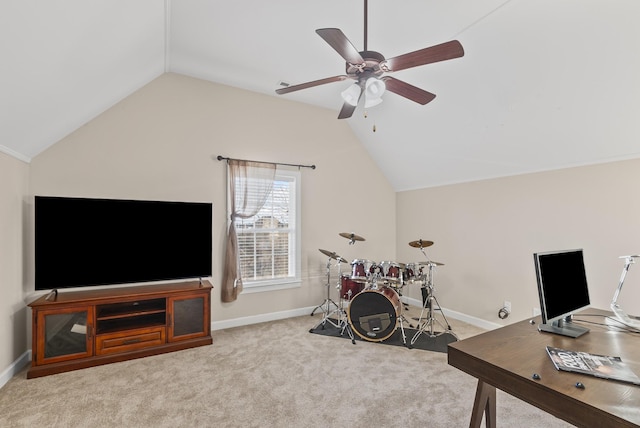 office featuring ceiling fan, light colored carpet, and vaulted ceiling