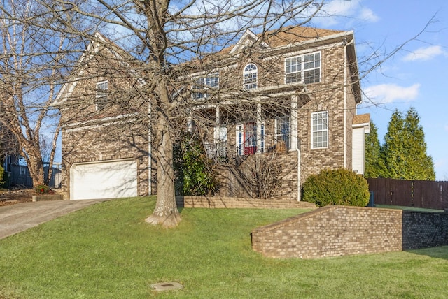 view of front of house featuring a front lawn and a garage