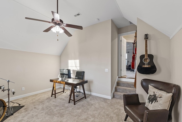 office space with ceiling fan, light colored carpet, and lofted ceiling