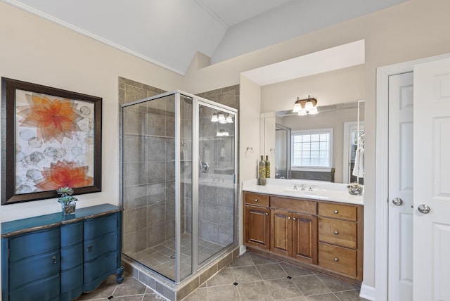 bathroom with vaulted ceiling, tile patterned floors, vanity, a shower with door, and an inviting chandelier