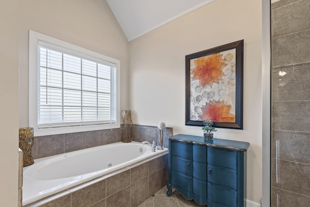 bathroom with ornamental molding, tile patterned flooring, vaulted ceiling, and tiled bath