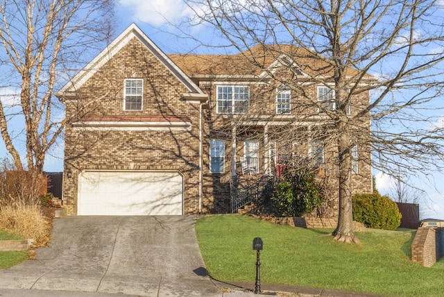 view of front of property with a garage and a front lawn