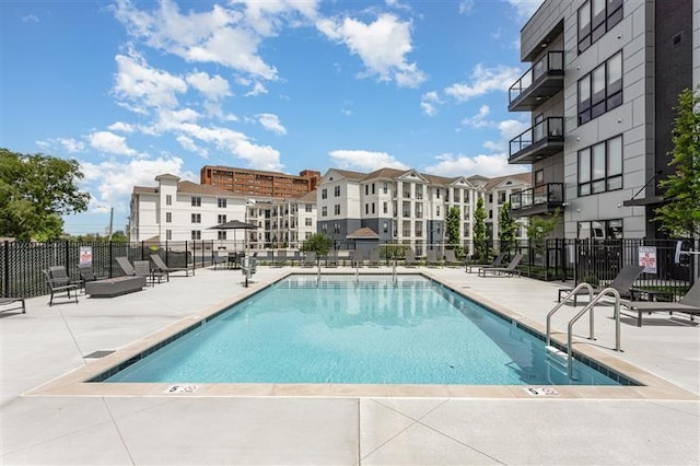 view of swimming pool with a patio