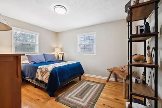 bedroom with hardwood / wood-style floors