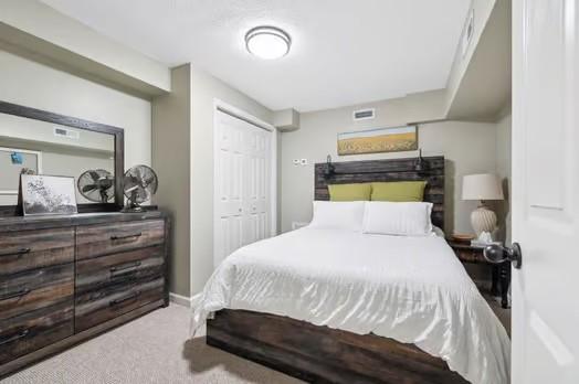 carpeted bedroom featuring a closet