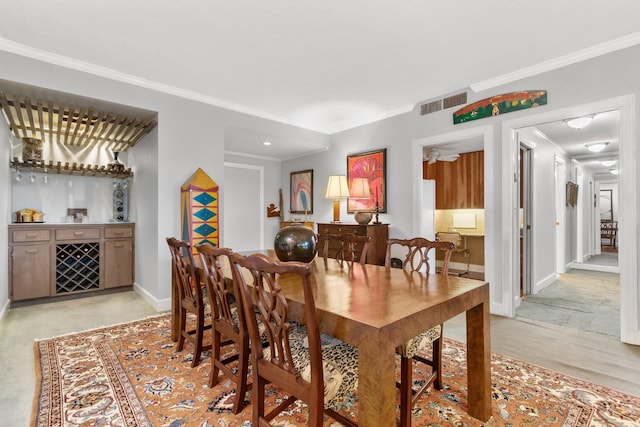 dining room featuring crown molding